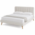 Cama doble tapizada beige con cabecero acolchado y patas de madera estructura de listones